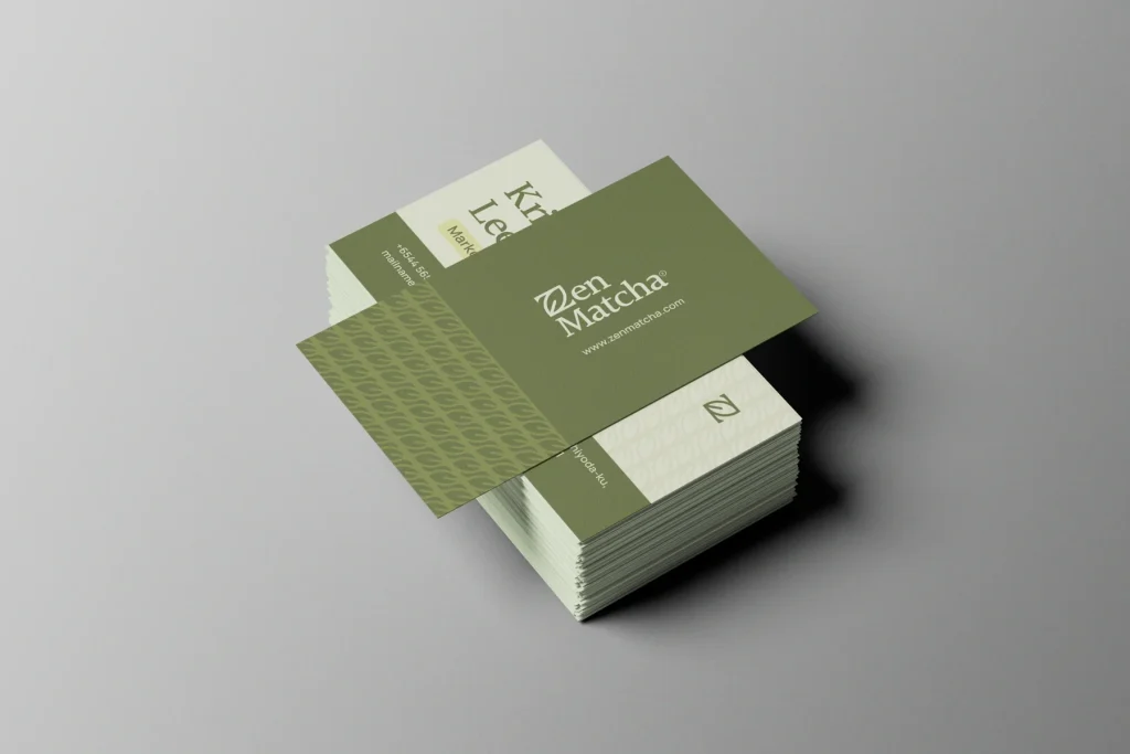 Custom business cards with a minimal design in a pastel green and cream colour theme.