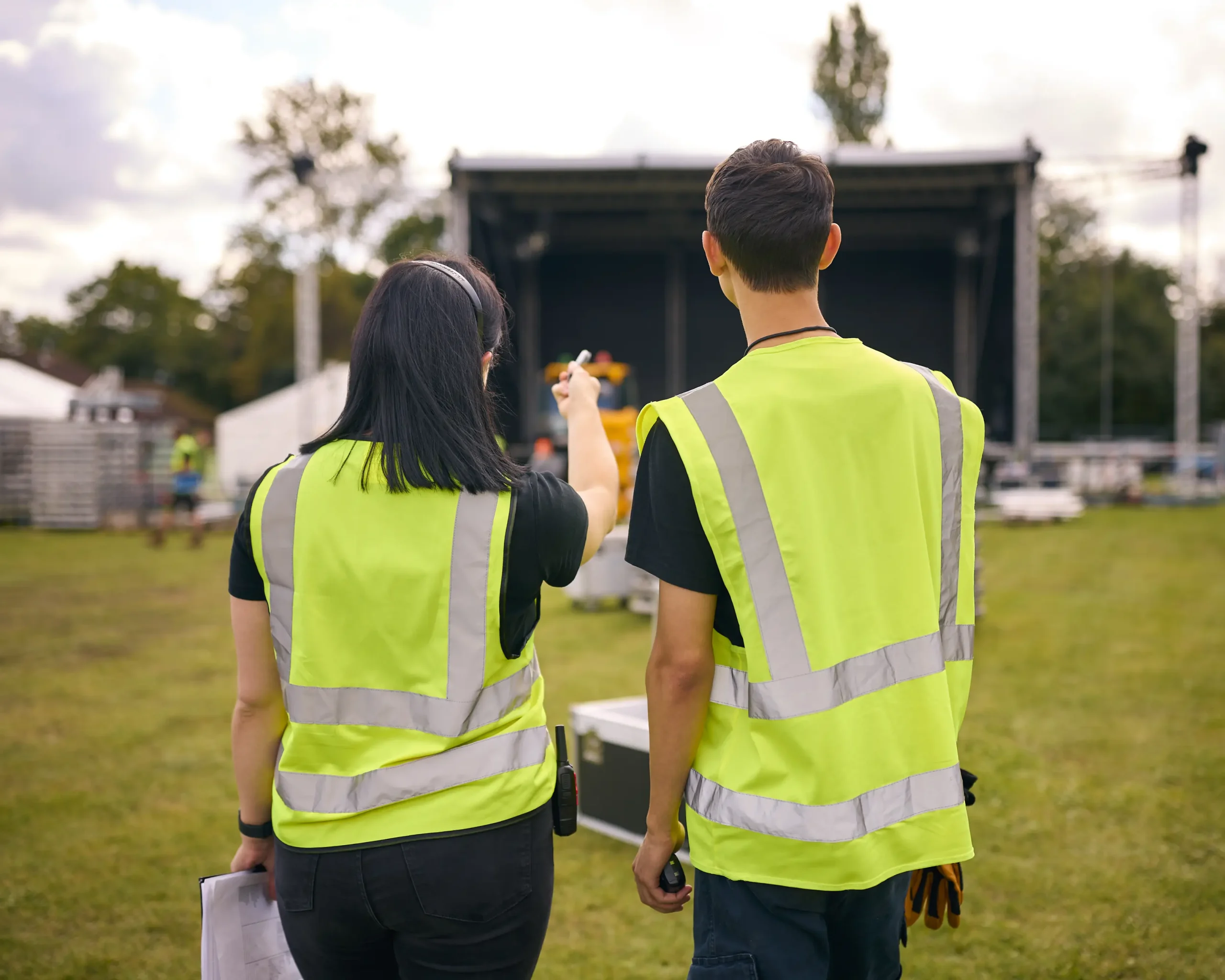 events planning team members in hi vis while scoping out and setting up for an event
