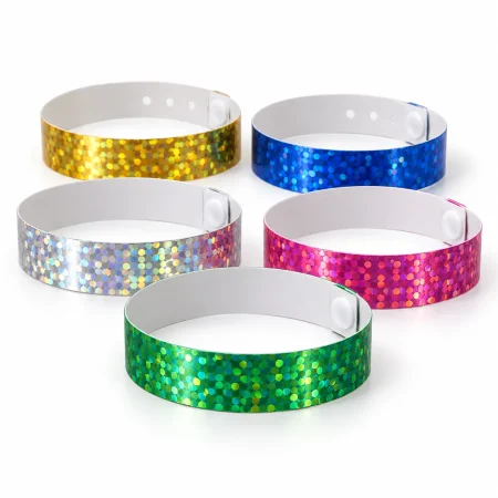 Green, gold, silver, blue and pink holographic wristbands with patterned foil surfaces and white reverse sides.